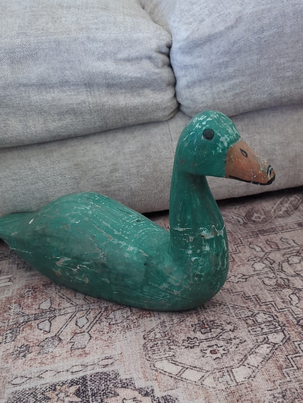 Vintage rustic decorative wooden duck decoy features a weathered green finish